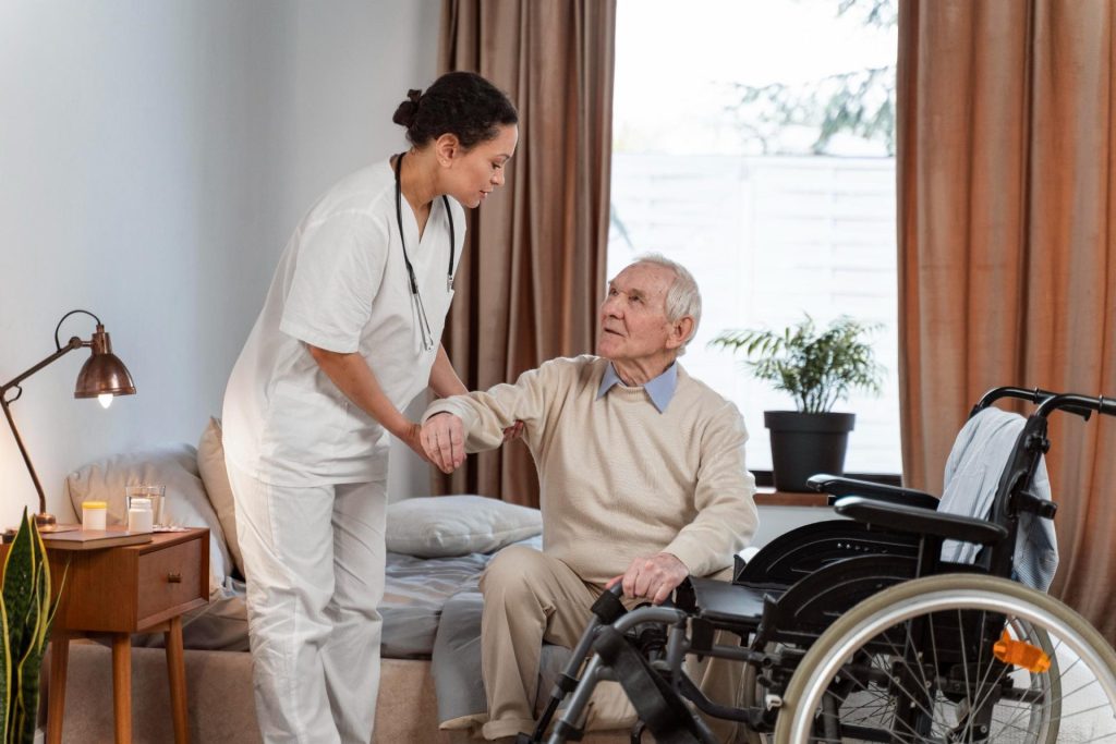 Caregiver assisting elderly man