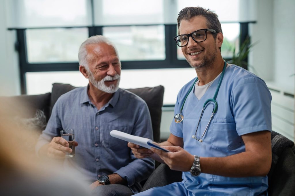 Doctor discussing with elderly patient