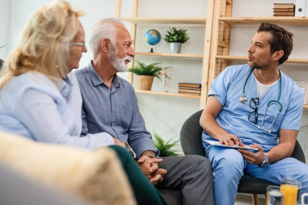 Doctor consulting with elderly couple