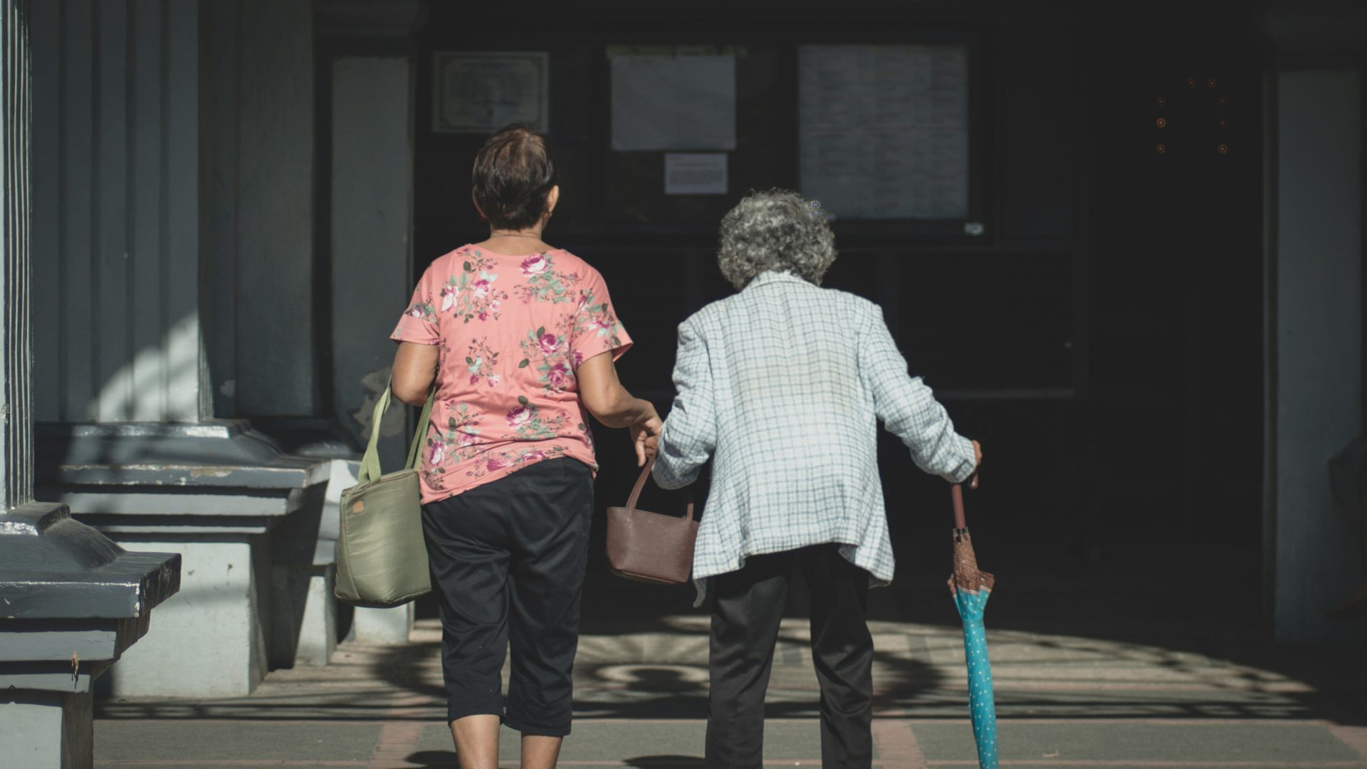 Caregiver assisting elderly person
