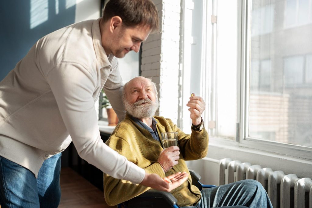 Man assisting elderly man
