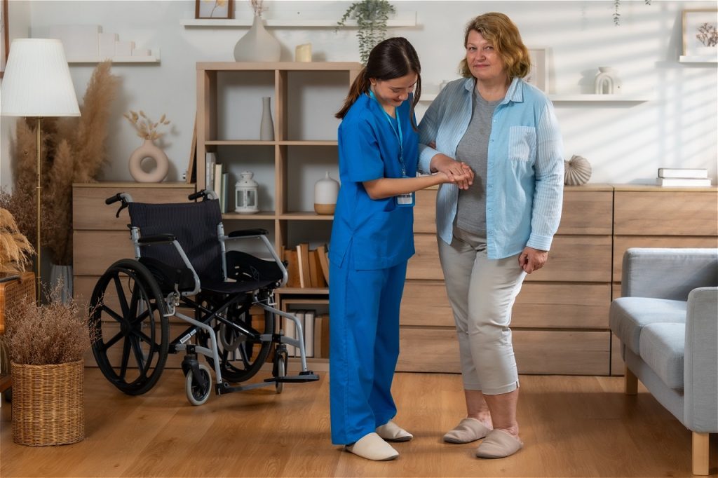 Nurse assisting elderly woman indoors